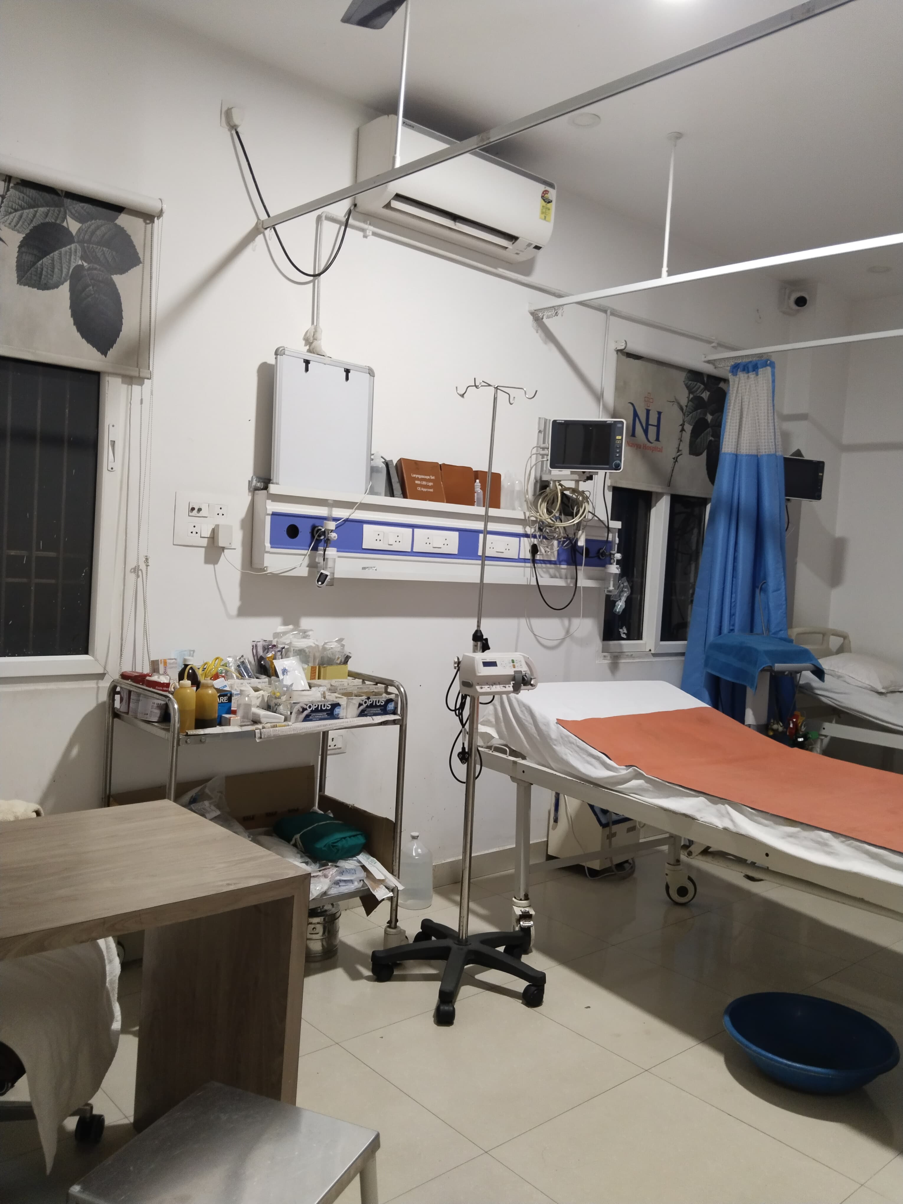 ICU and emergency treatment room equipped with IV stand, patient monitor, and medical supplies