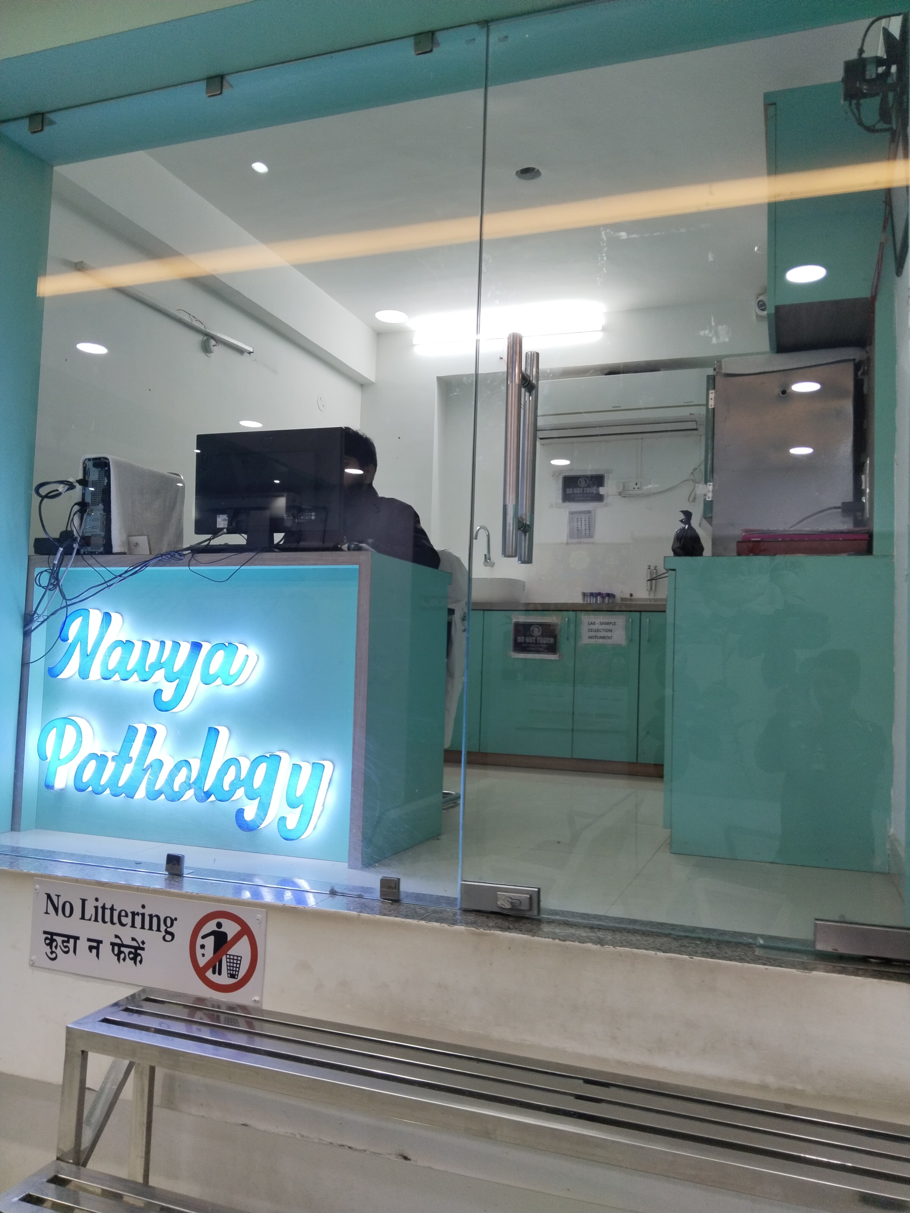 Navya Pathology diagnostic lab counter with glass partition and workstation