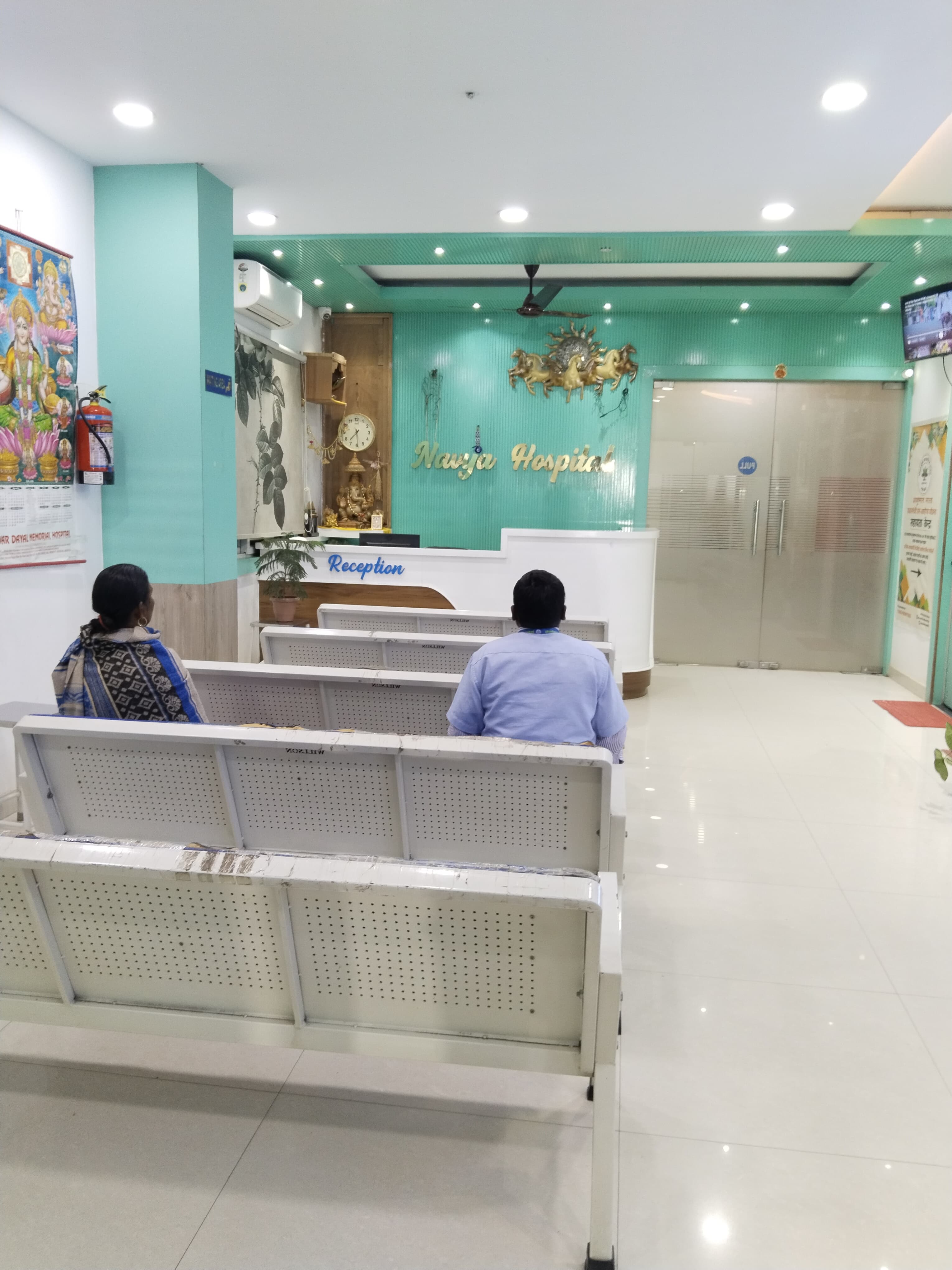 Navya Hospital reception and waiting area with seating for patients and families